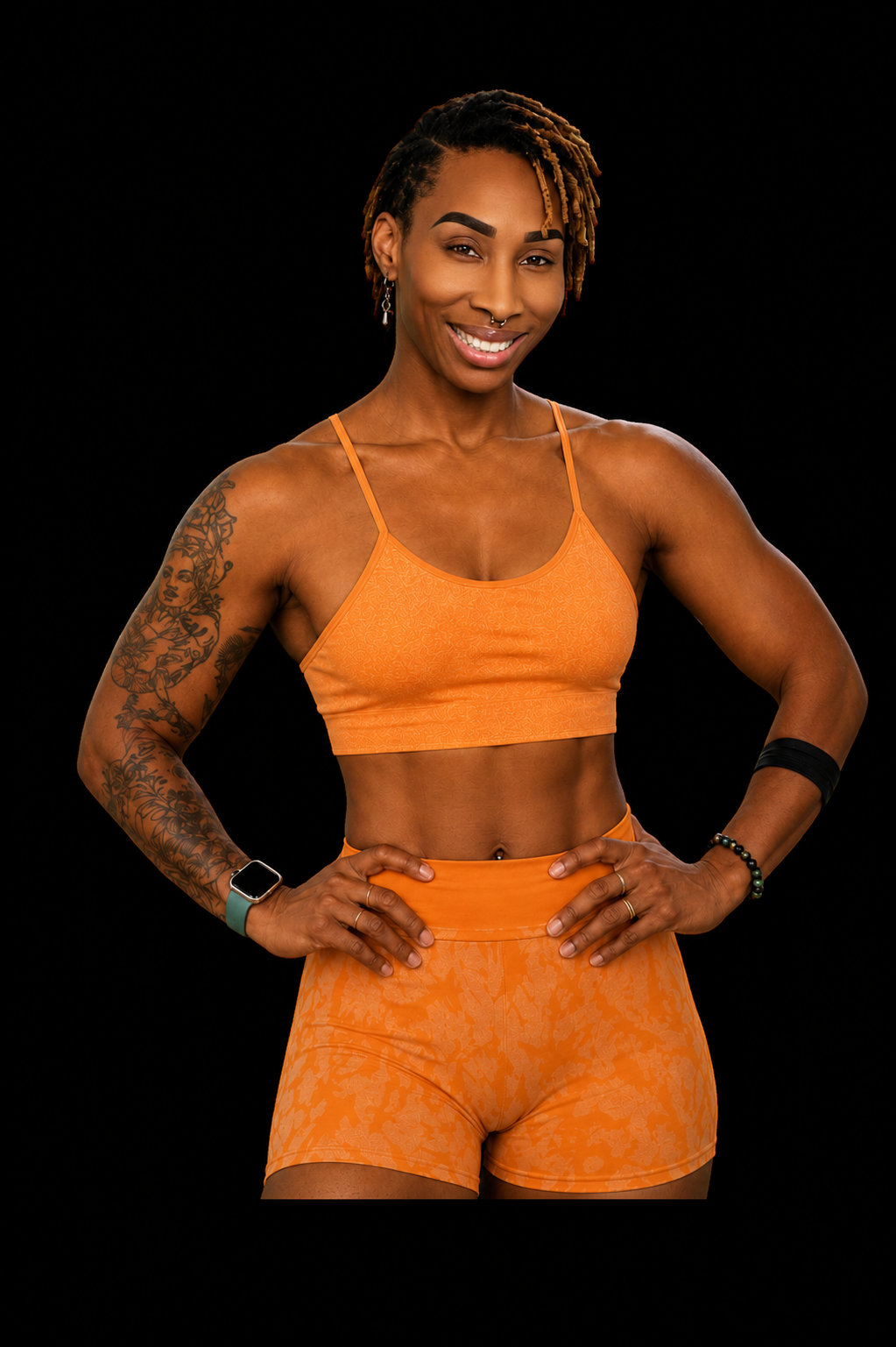 Coach Nika in orange athletic outfit, empowering girls through strength training